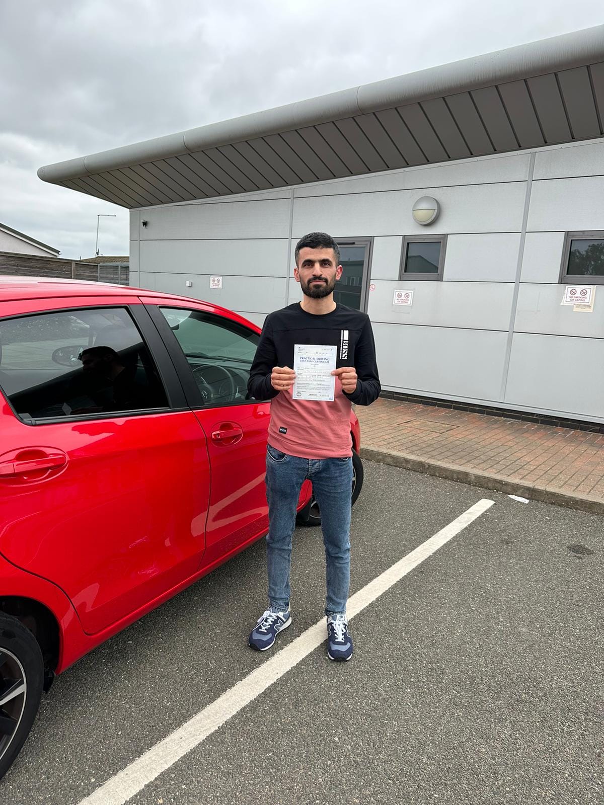 MSA Driving School pupil holding their pass certificate