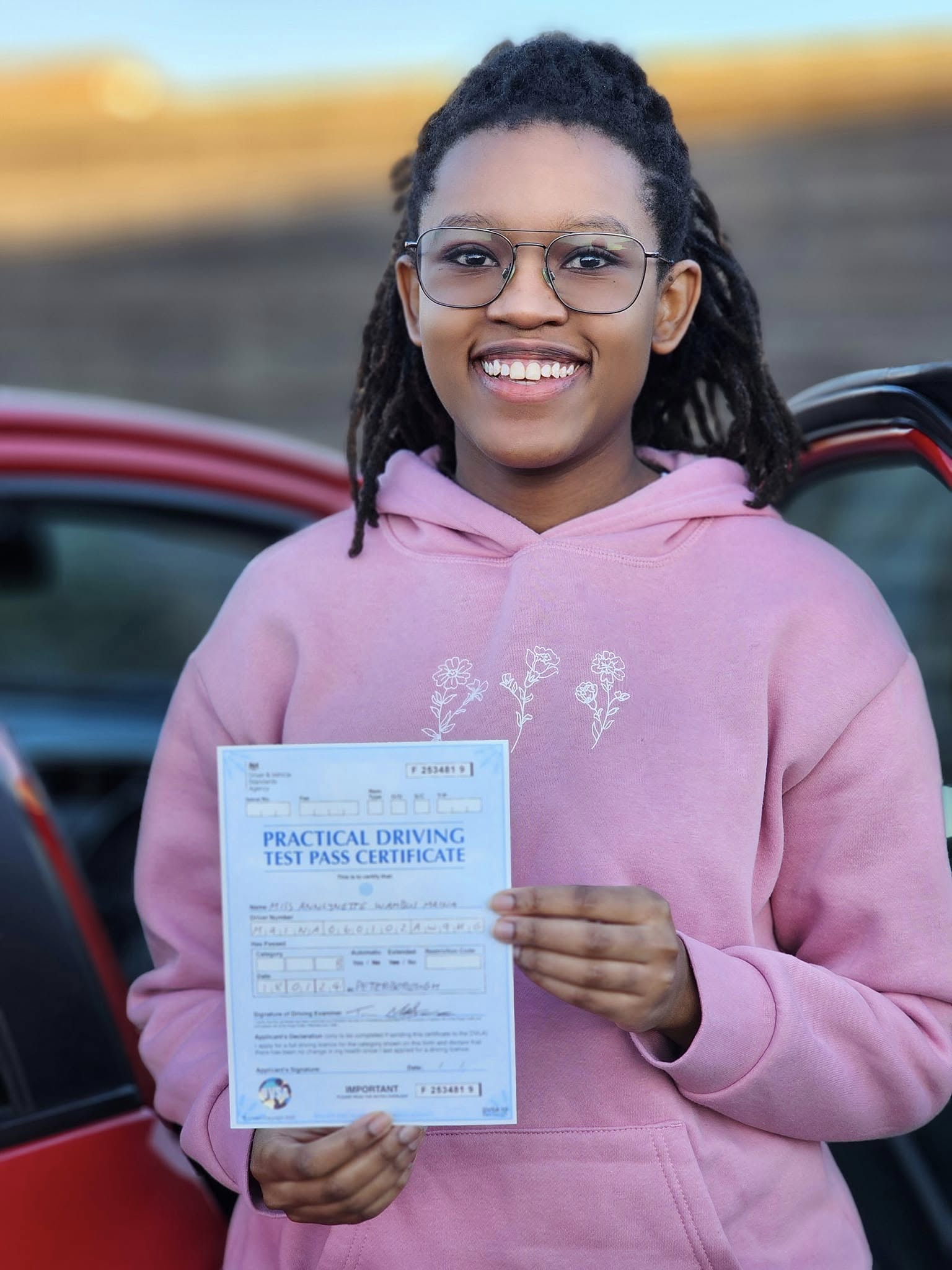 MSA Driving School pupil holding their pass certificate
