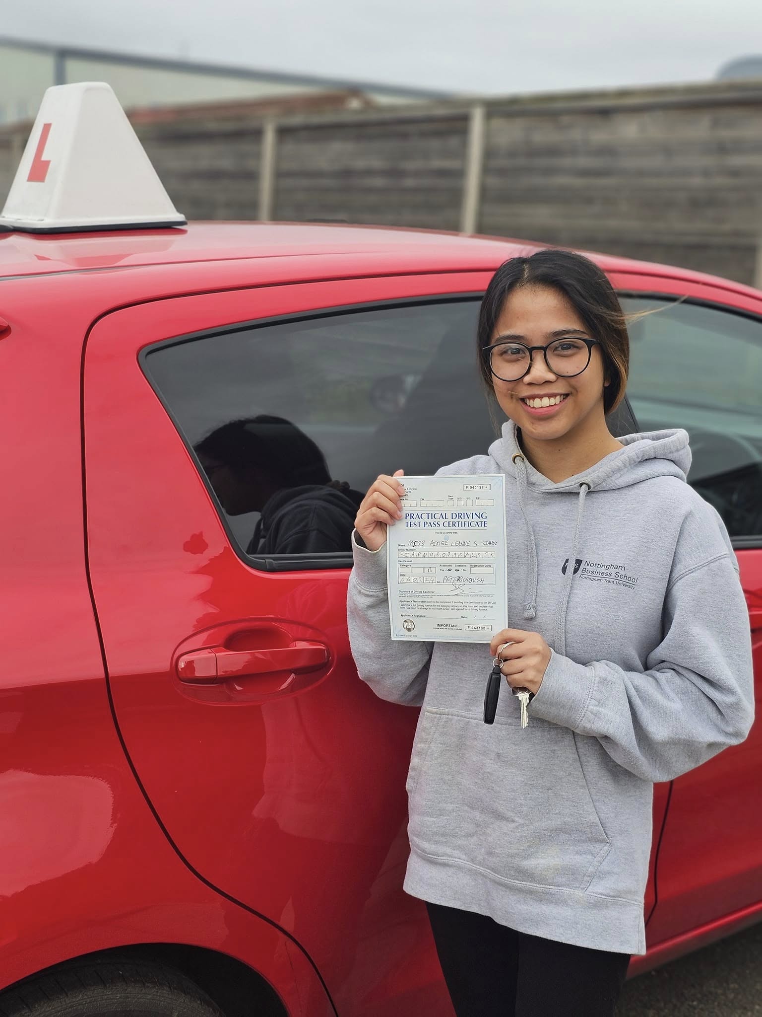 MSA Driving School pupil holding their pass certificate