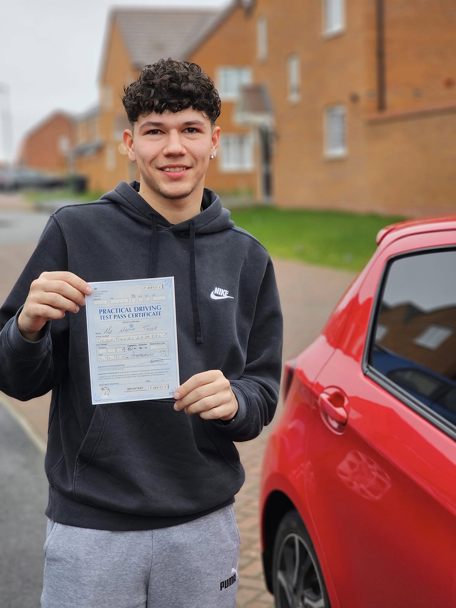 MSA Driving School pupil holding their pass certificate