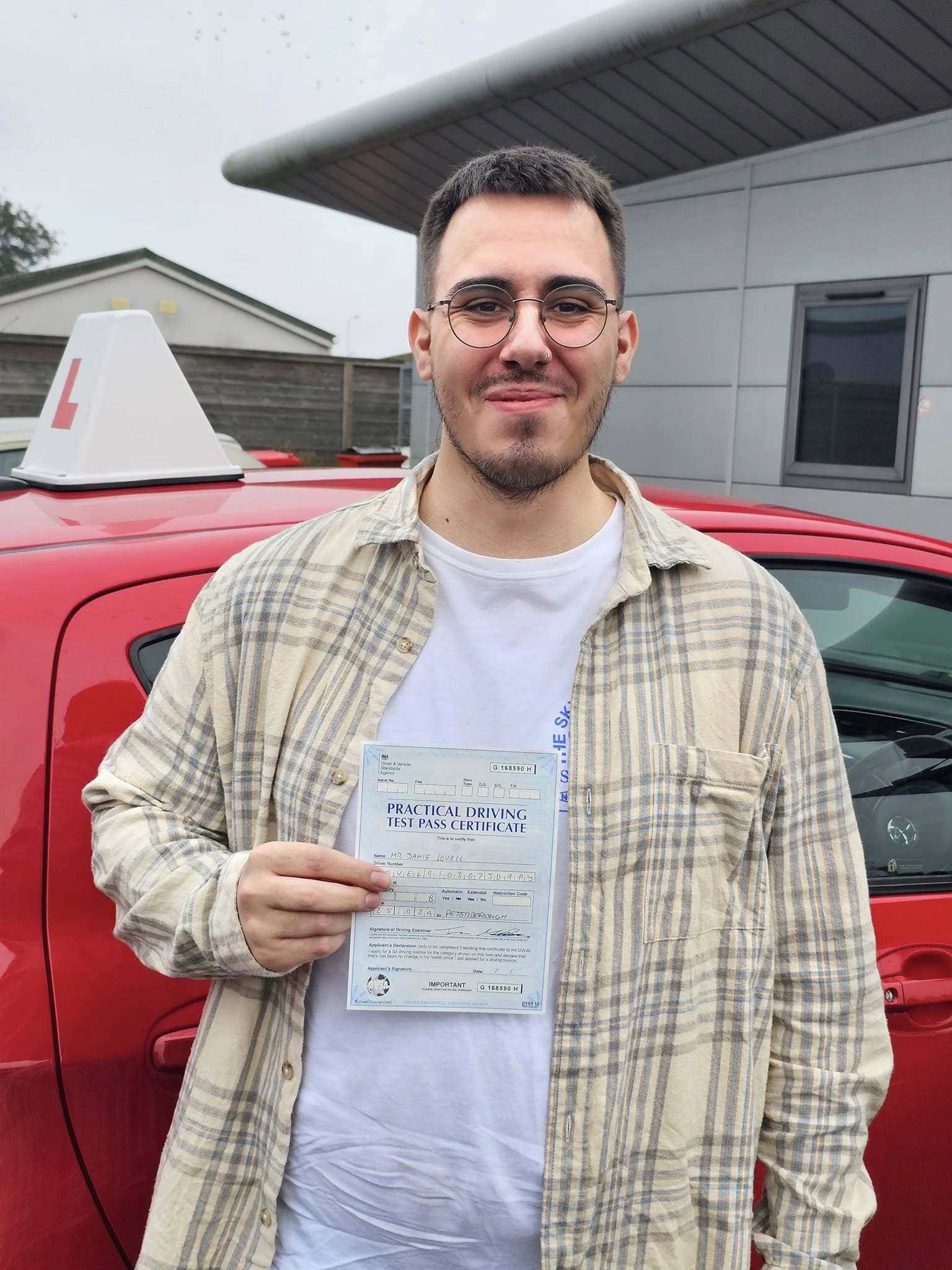 MSA Driving School pupil holding their pass certificate