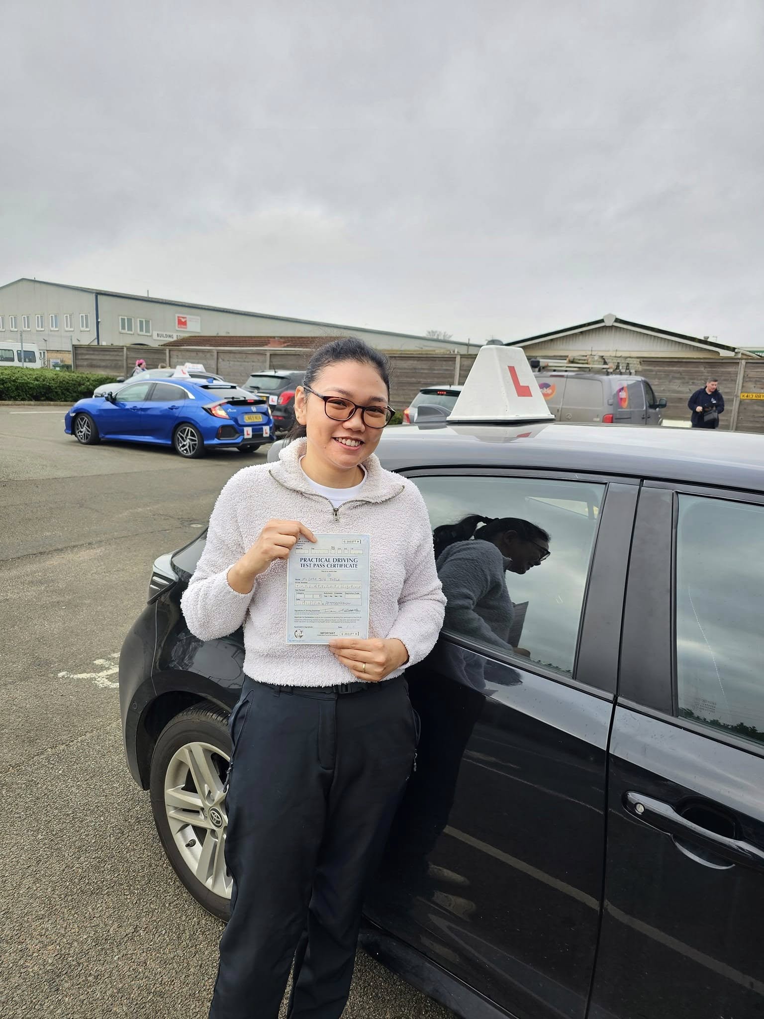 MSA Driving School pupil holding their pass certificate