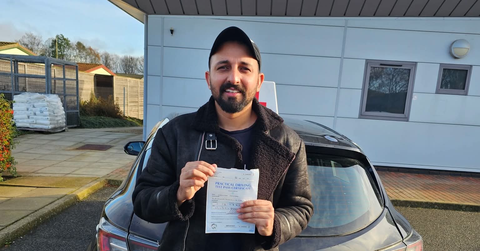MSA Driving School pupil holding their pass certificate