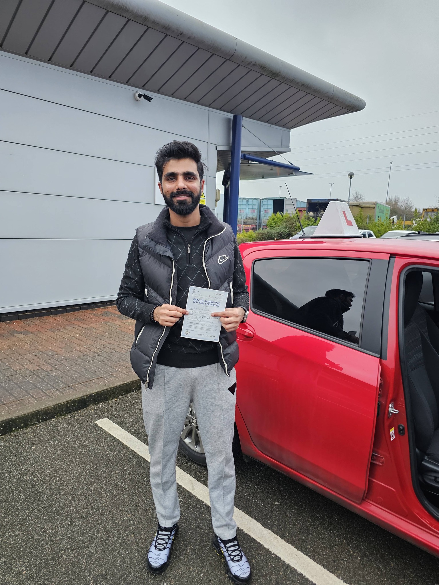 MSA Driving School pupil holding their pass certificate