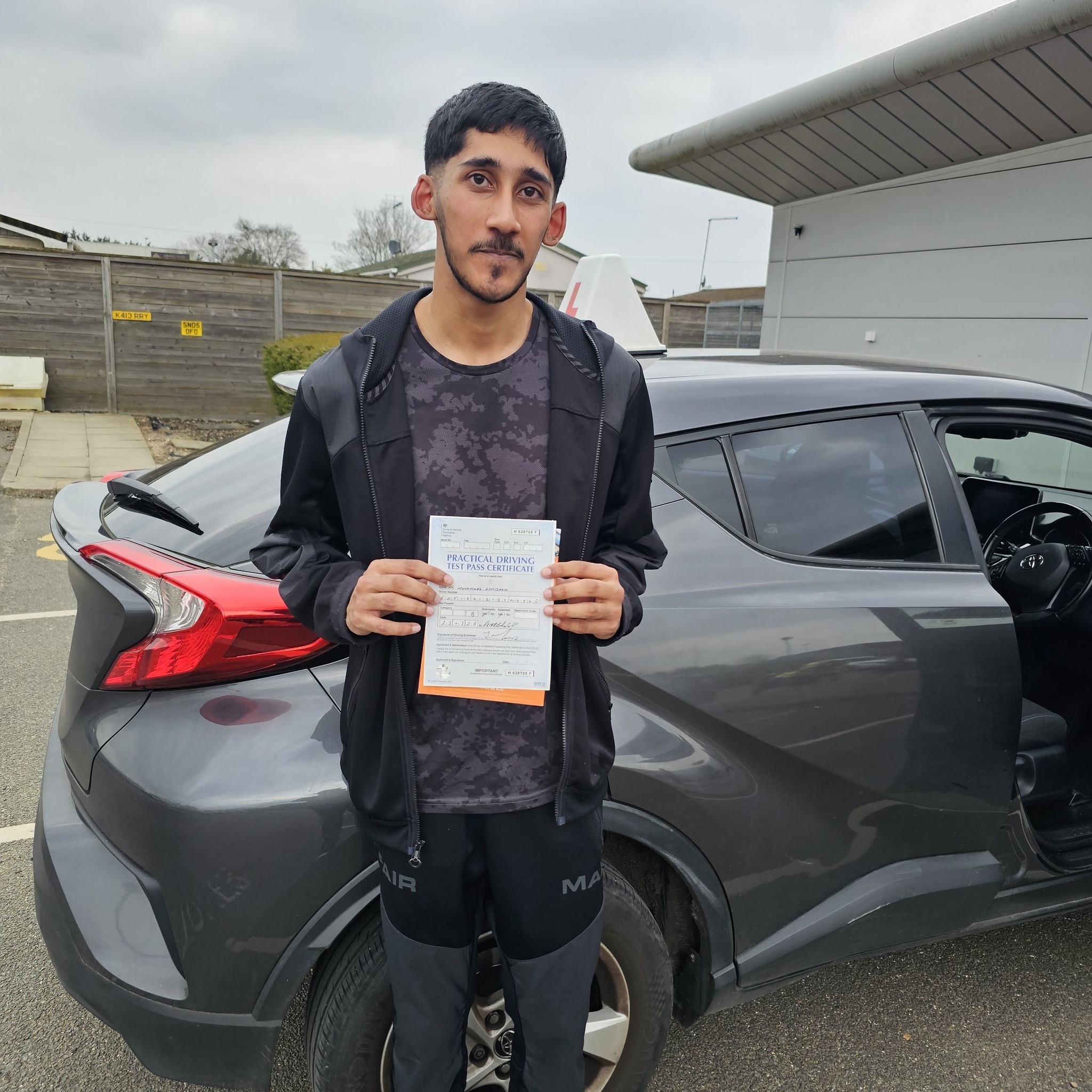 MSA Driving School pupil holding their pass certificate