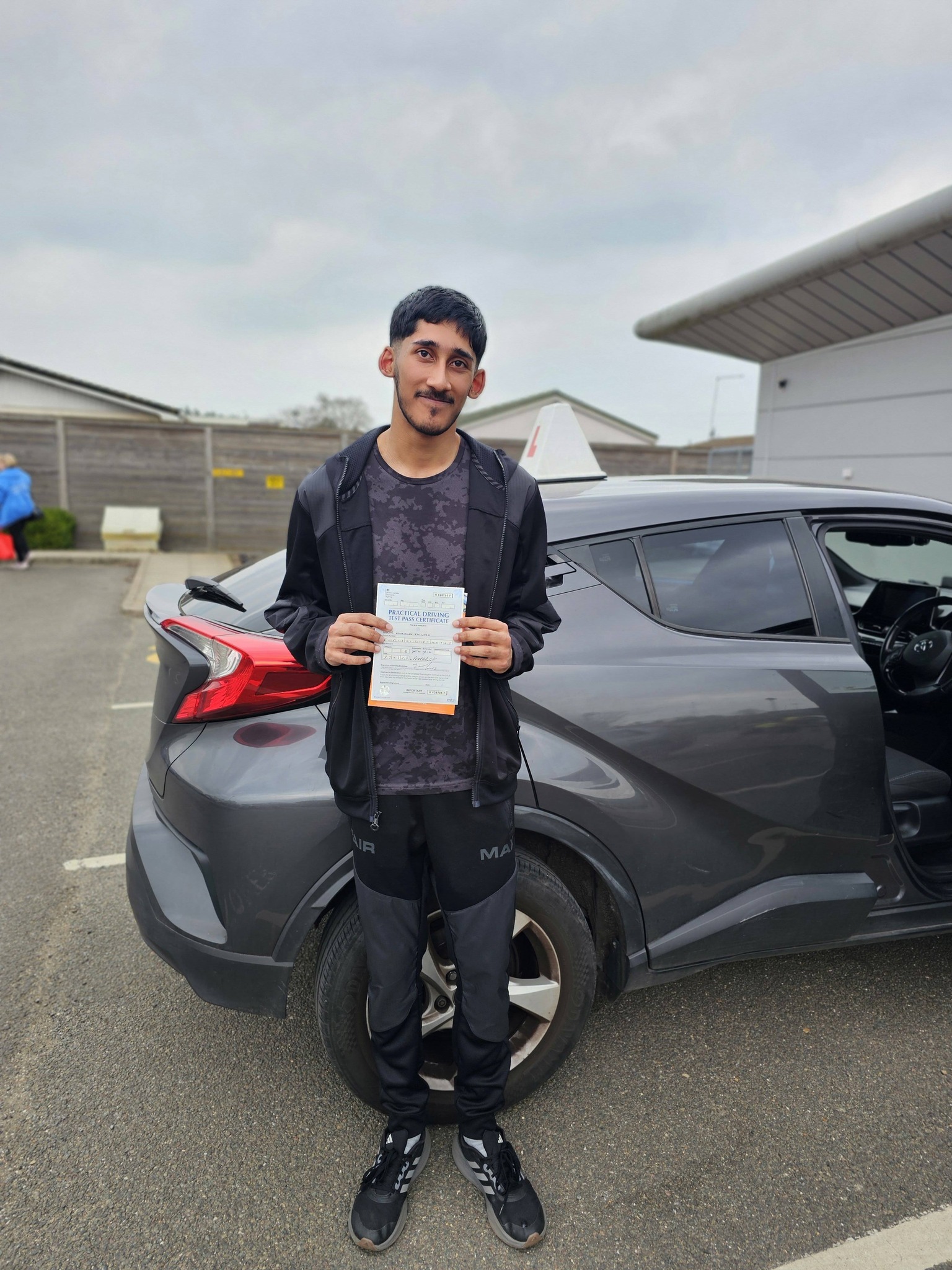 MSA Driving School pupil holding their pass certificate
