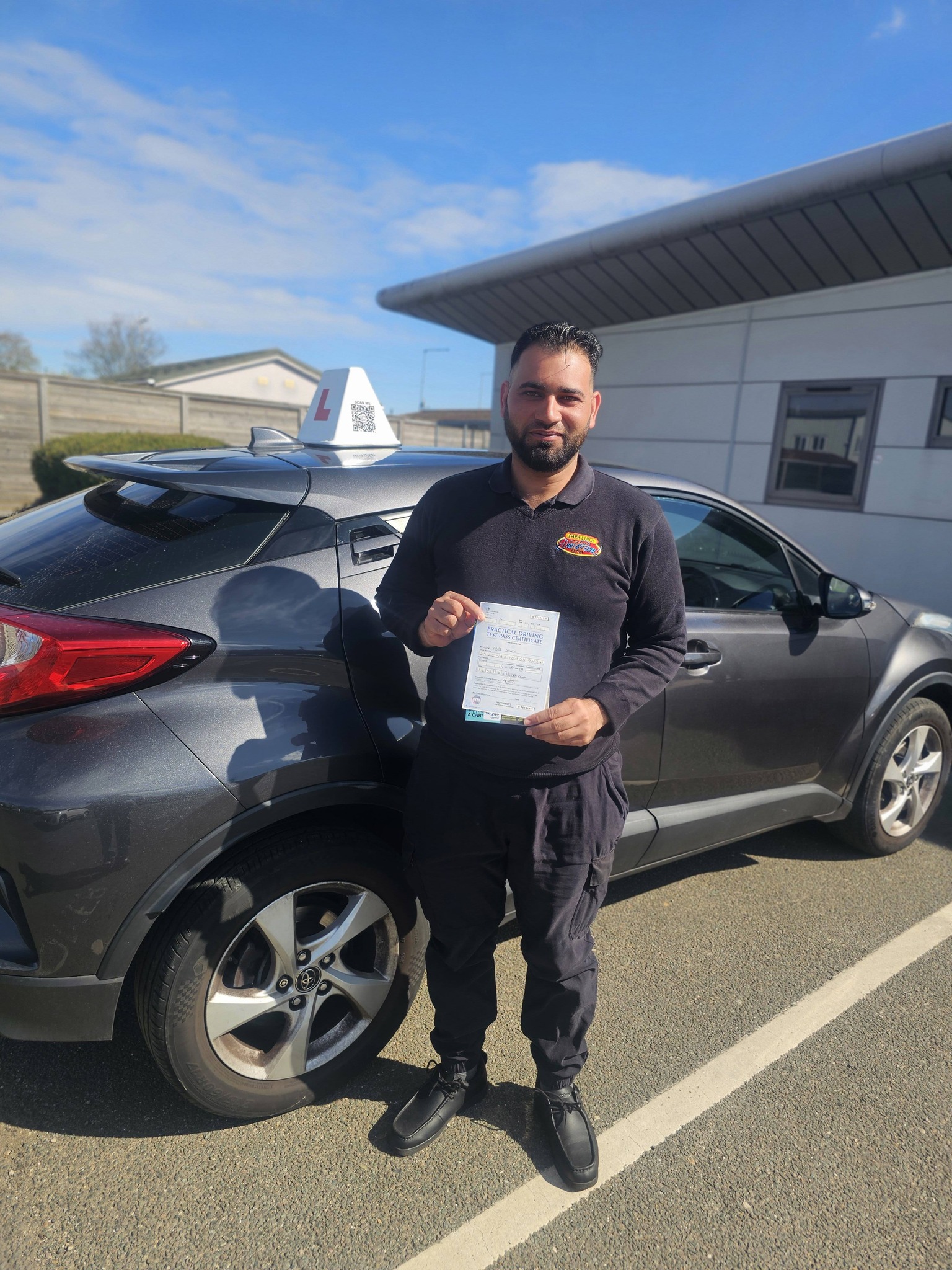 MSA Driving School pupil holding their pass certificate