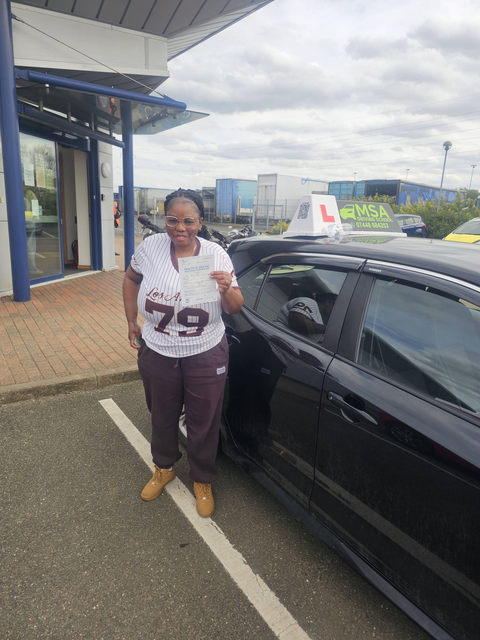 MSA Driving School pupil holding their pass certificate