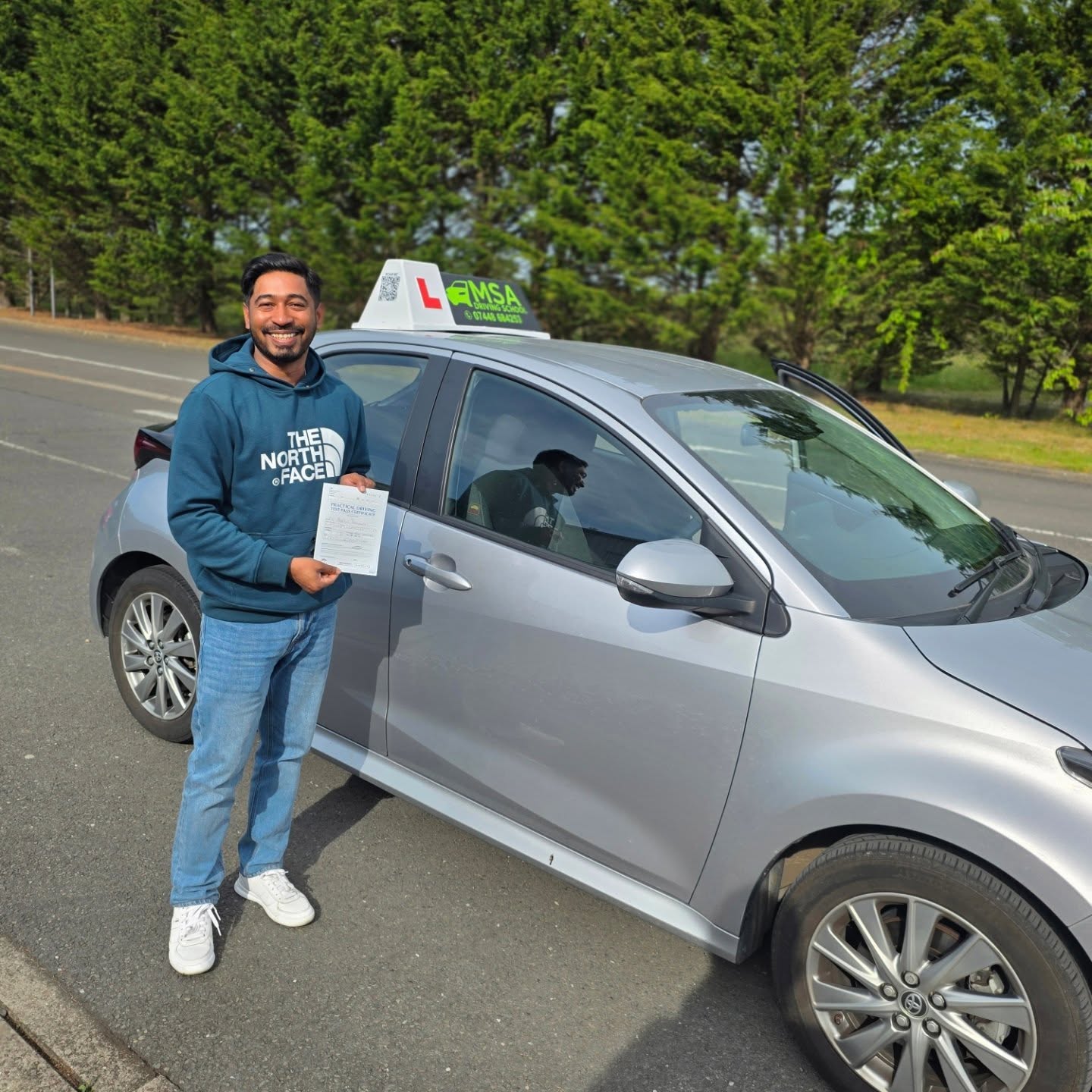 MSA Driving School pupil holding their pass certificate